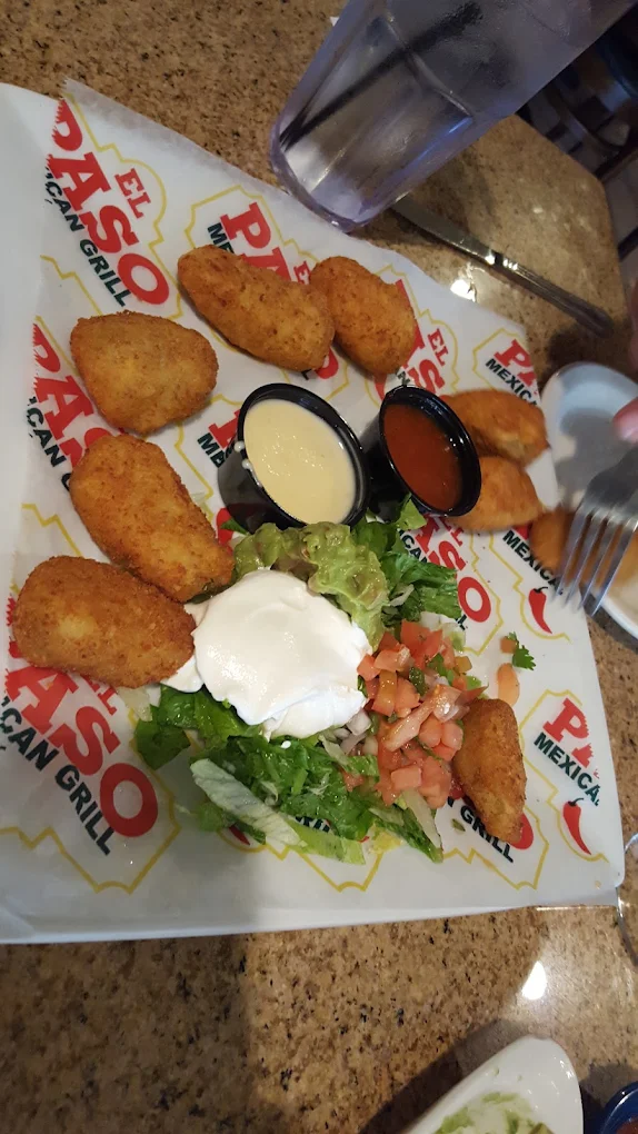 Stuffed Jalapeños - Fresh jalapeños stuffed with cream cheese and wrapped in crispy bacon