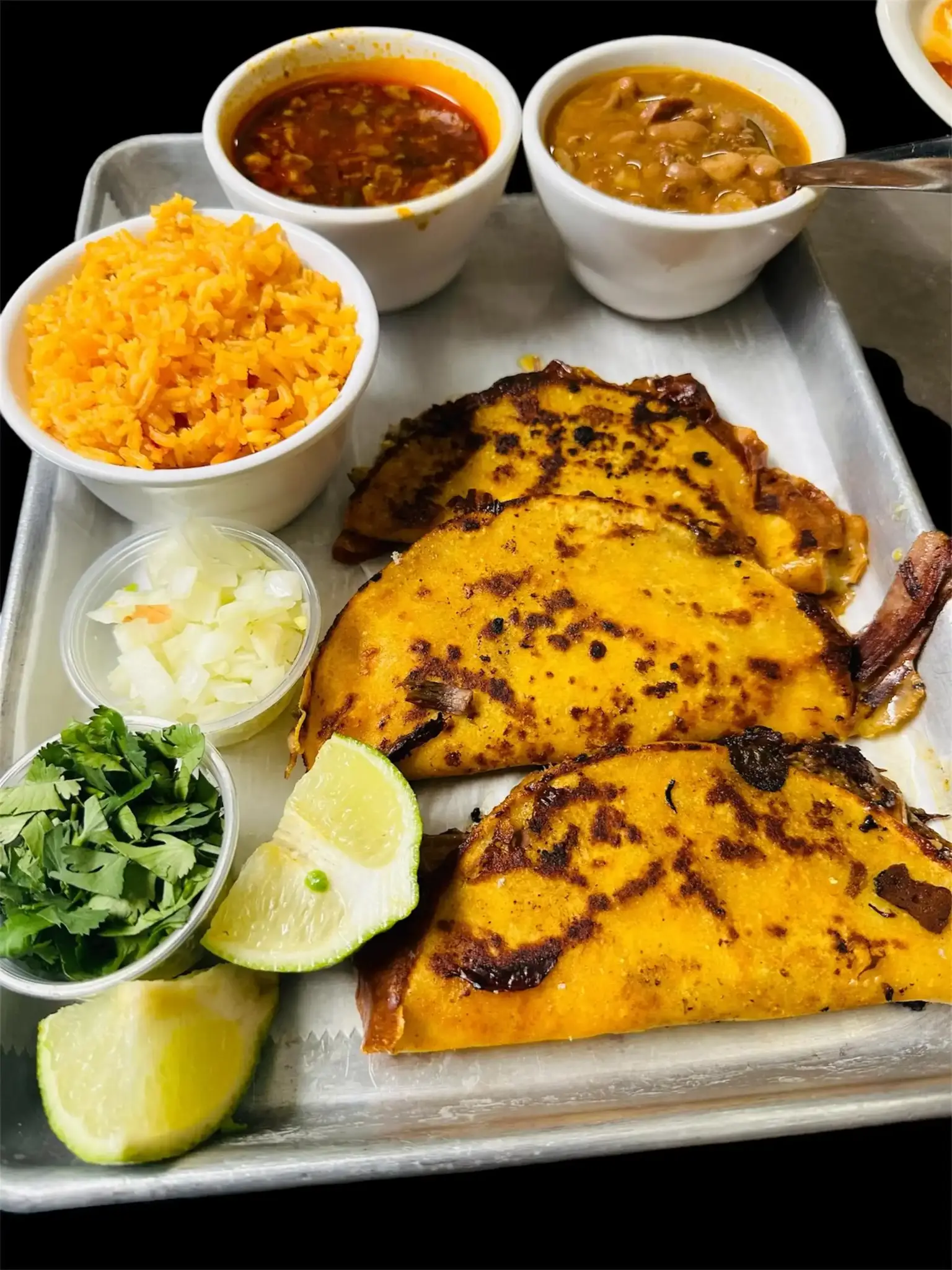 Tacos de Birria - Slow-cooked beef tacos with consommé